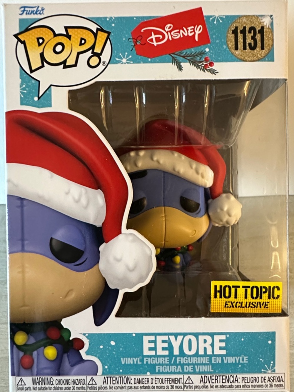 Funko Eeyore Pop! Vinyl in Red Santa Hat and Purple Body